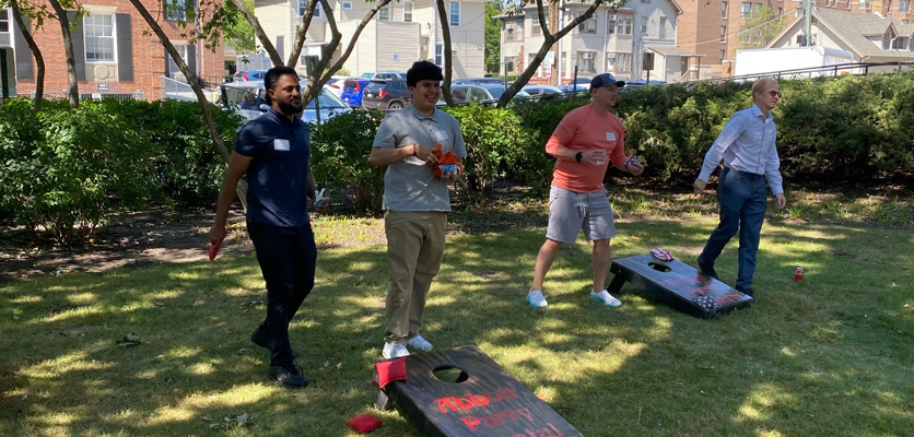Northwestern IT staff gathered on the front lawn of the John Evans Center in Evanston for a friendly game of bags.