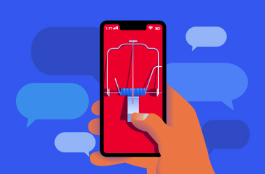hand holding a cell phone in the shape of a mousetrap