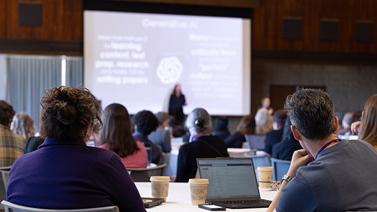Attendees listen to the TEACHx keynote speaker in a packed Louis Room