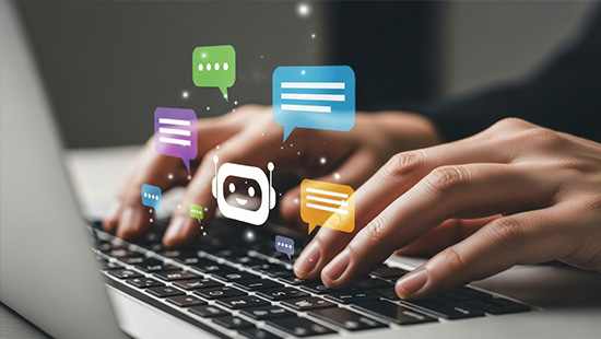 Hands typing on a laptop with floating chat bubbles above.